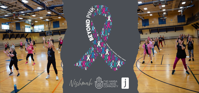 Several dozen women and men wearing pink and black exercise in a gym together, perhaps doing Zumba. The image appears torn in the center, with the Beyond Pink, Nishmah, Hamsa Wellness Community, and J logos in the middle.