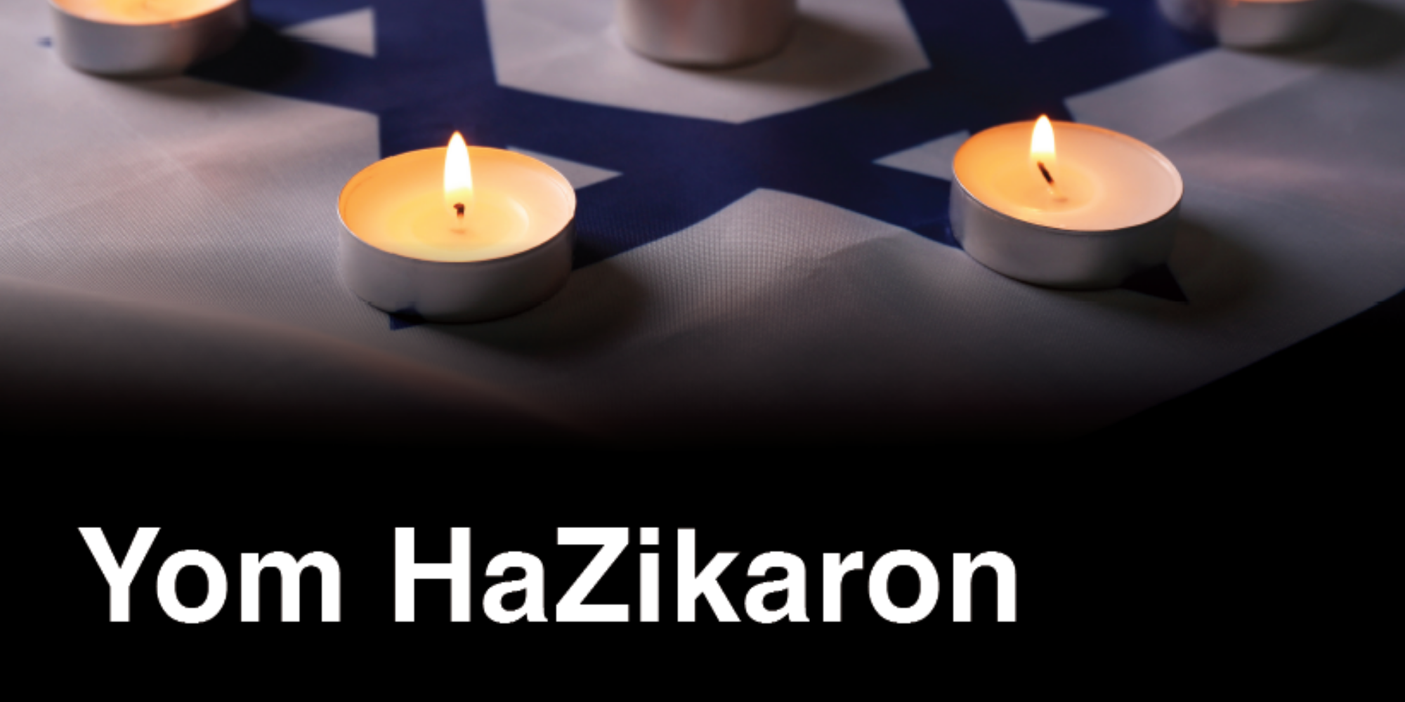 Yom HaZikaron. Photo of an Israeli flag laid out with tealight candles on each of the six corners.