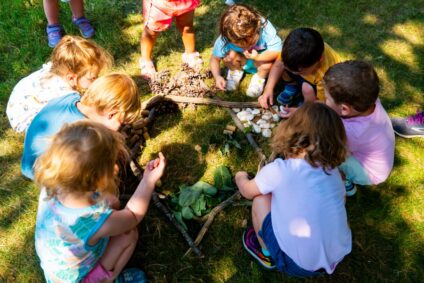 early childhood campers, outside making star of david nature art